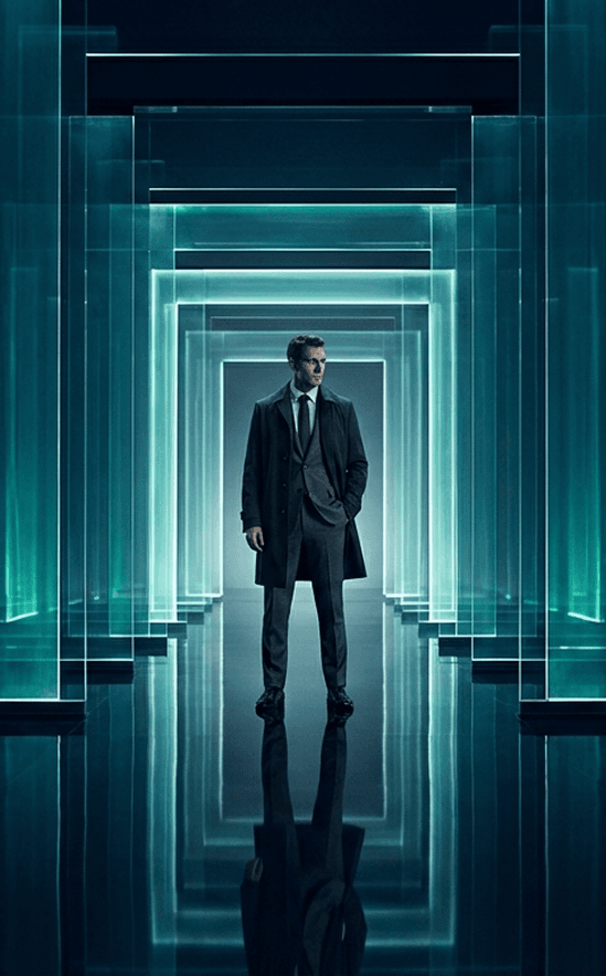 Businessman standing in a glowing glass corridor