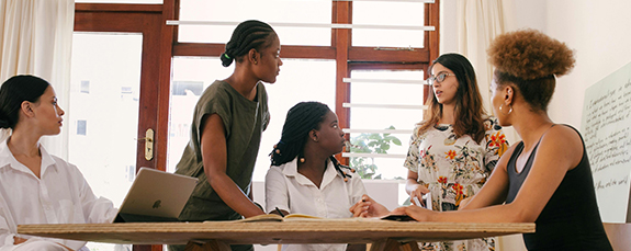 Team meeting around a table in a bright office