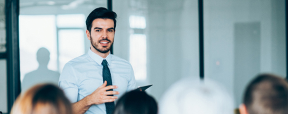 Presenter speaking to colleagues in a meeting