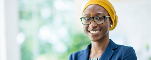 Smiling professional in a yellow headscarf